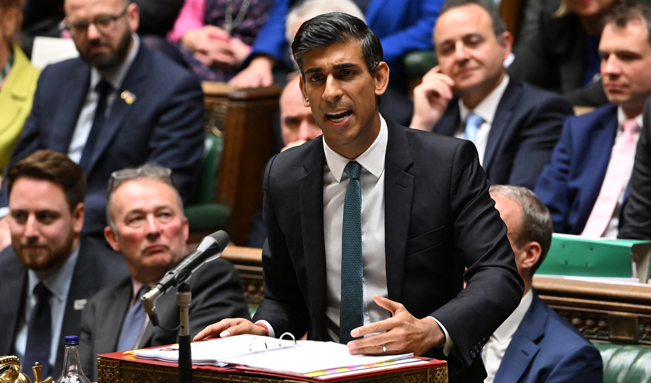 A handout photograph released by the UK Parliament shows Britain's Prime Minister Rishi Sunak speaking during his first Prime Minister's Questions (PMQs) in the House of Commons in London on October 26, 2022. (AFP)
