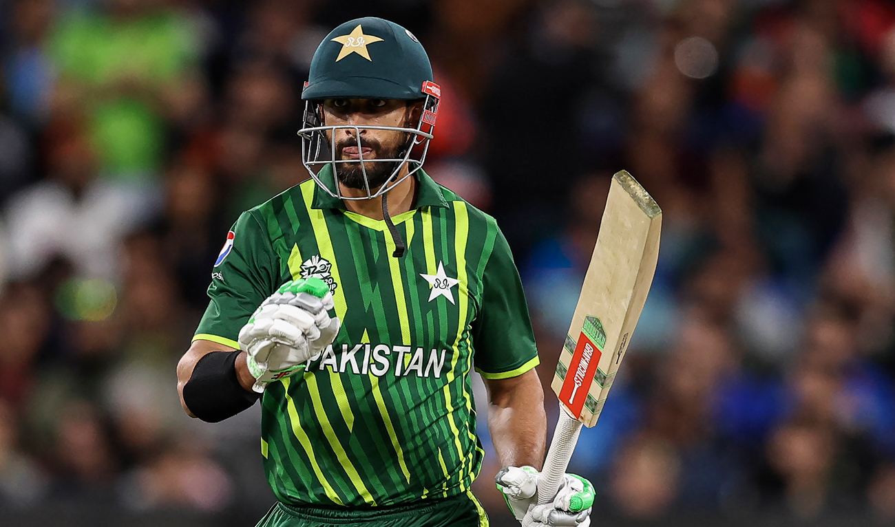 Pakistan's Shan Masood raises his bat after passing 50 runs during the ICC men's Twenty20 World Cup 2022 cricket match between India and Pakistan at Melbourne Cricket Ground (MCG) in Melbourne on October 23, 2022. (AFP)