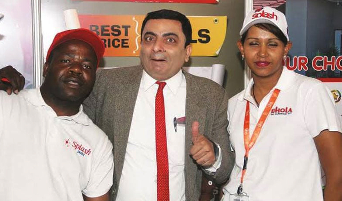 This undated photo shows Pakistani comedian Asif Muhammad, impersonating as television character Mr Bean, with the organizers of his show in Zimbabwe. (Social Media)