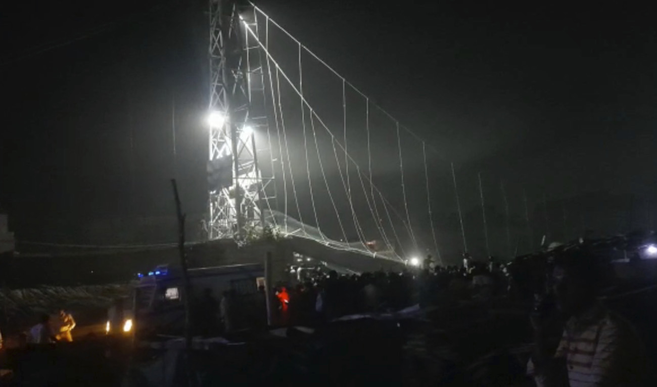 Rescuers work at night after a cable bridge across the Machchu river collapsed in Morbi district, western Gujarat state, India, Sunday, Oct.30, 2022. (AP)