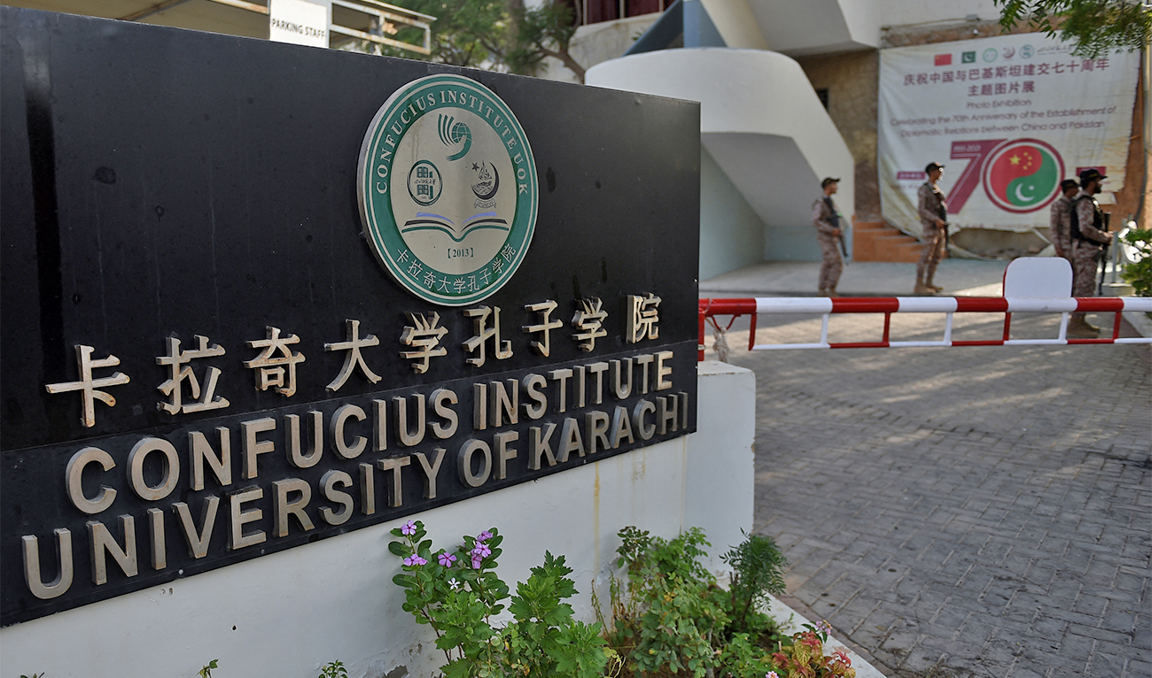 Rangers stand guard nearby the blast site a day after a suicide attack on a van near the Confucius institute which is the cultural programme that China operates at universities around the world at the Karachi University in Karachi on April 27, 2022. (AFP)