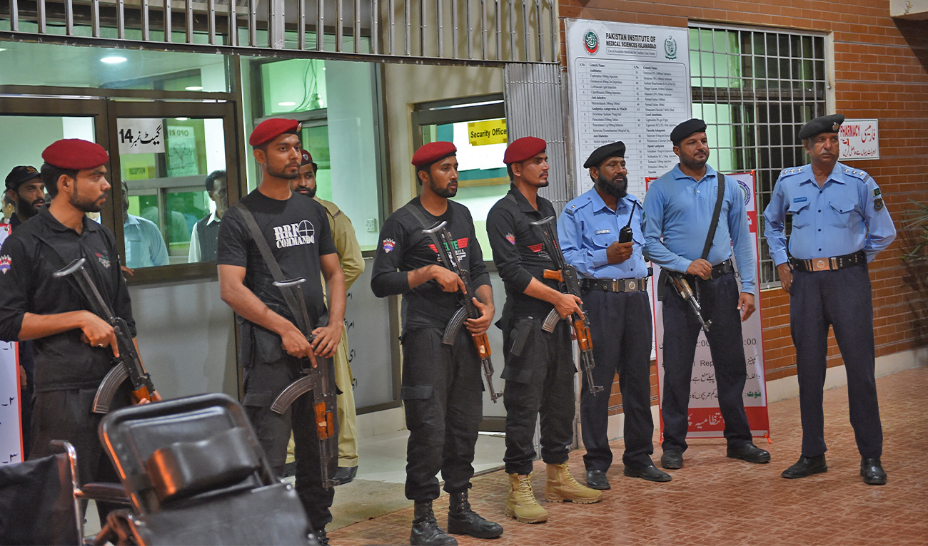 Pakistani police commondos and policemen stand at the Pakistan Institute of Medical Sciences (PIMS) in Islamabad on July 29, 2018. (AFP/File)