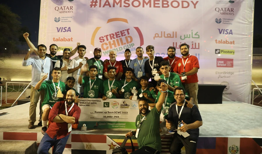 Team Pakistan poses for a group photo with the runner up trophy after the final of Street Child World Cup in Doha on October 15, 2022. (Photo courtesy: Muslim Hands Pakistan)