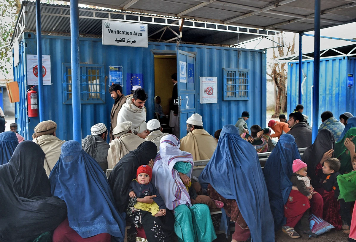 Afghan refugees wait to update their family data at the UNHCR Verification Center in Chamkani, on the outskirts of Peshawar on January 26, 2017. (AFP/File)