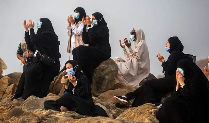 A handout picture provided by the Saudi Ministry of Media on July 30, 2020 shows Muslim pilgrims praying on Mount Arafat, also known as Jabal al-Rahma (Mount of Mercy), southeast of the holy city of Makkah. (AFP/FILE)