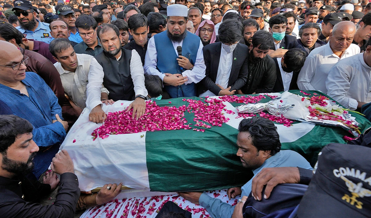 People attend the funeral prayer of slain senior Pakistani journalist Arshad Sharif, in Islamabad, Pakistan, on October 27, 2022. (AP)
