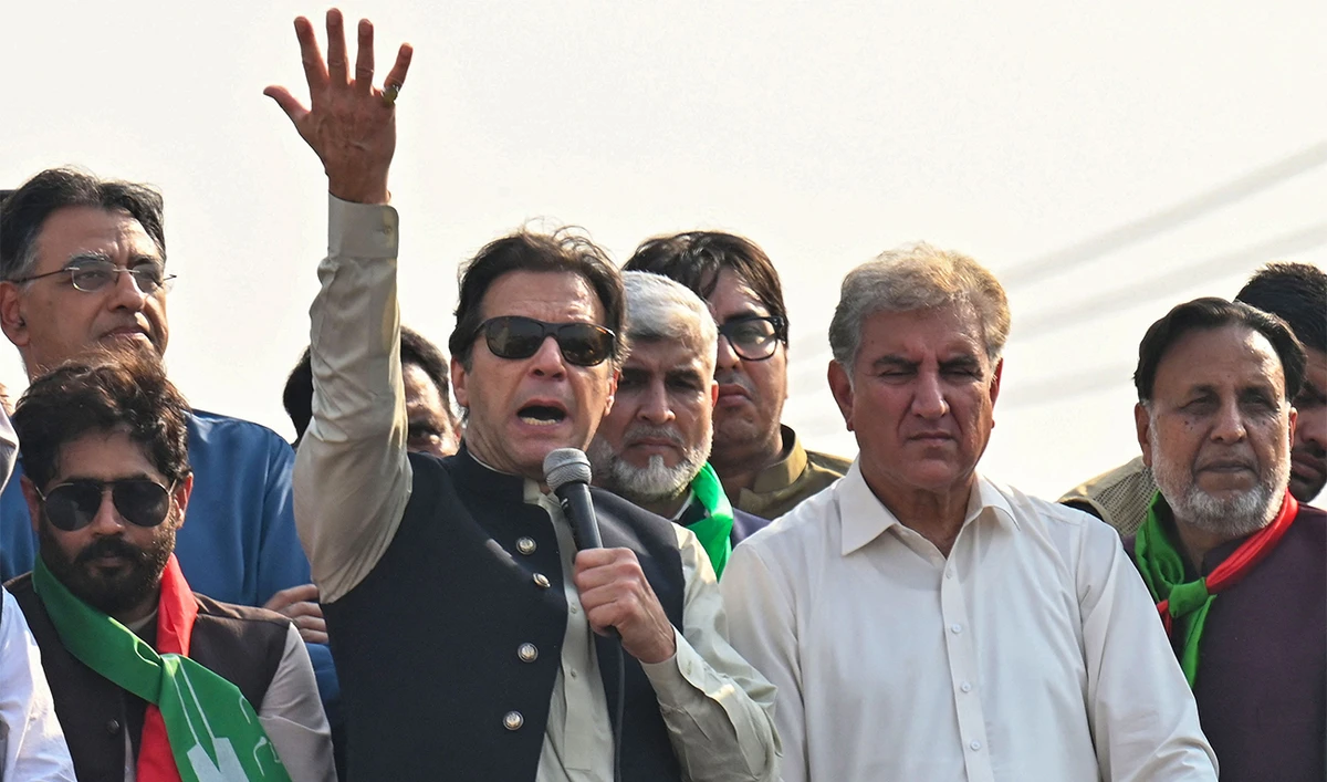 Former Pakistan prime minister Imran Khan (C) addresses his supporters during an anti-government long march towards Islamabad to demand early elections, in Lahore on October 29, 2022. (AFP)