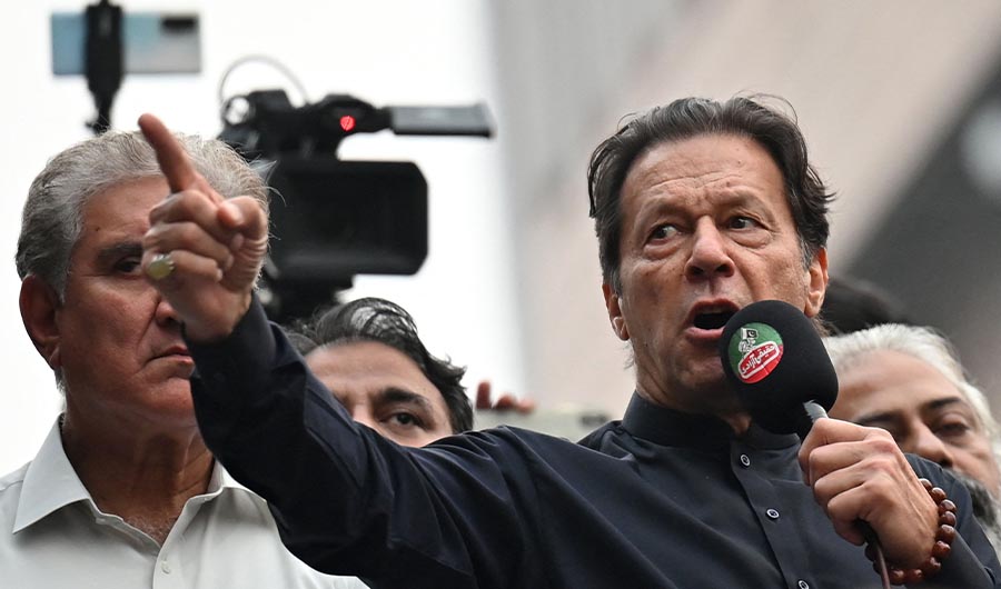 Pakistan's former prime minister Imran Khan (C) addresses his supporters during an anti-government march towards capital Islamabad, demanding early elections, in Gujranwala on November 1, 2022. (AFP)