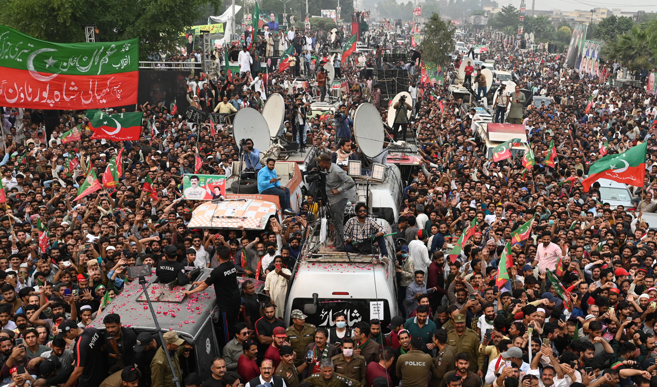 Supporters of Pakistan's former prime minister Imran Khan take part of an anti-government march towards capital Islamabad, demanding early elections, in Gujranwala on November 1, 2022. (AFP)