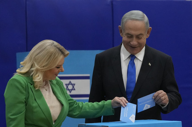 Likud party chairman Benjamin Netanyahu and his wife Sara cast their ballots during Israeli elections in Jerusalem, Tuesday, Nov. 1, 2022. (AP Photo)