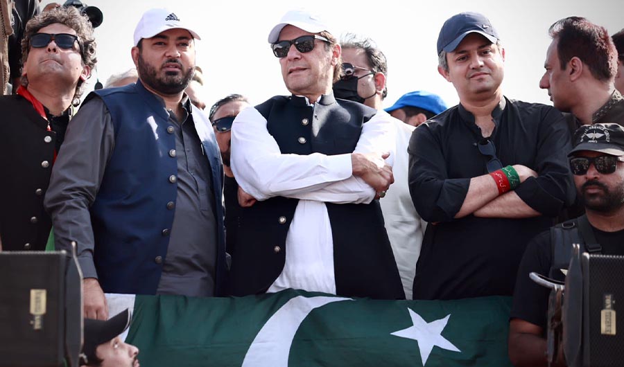 Pakistan's former prime minister Imran Khan (C) stands with his party leaders on a container during long march in Gakhar Mandi, Pakistan on Nov. 2, 2022. (Photo courtesy: Social Media)