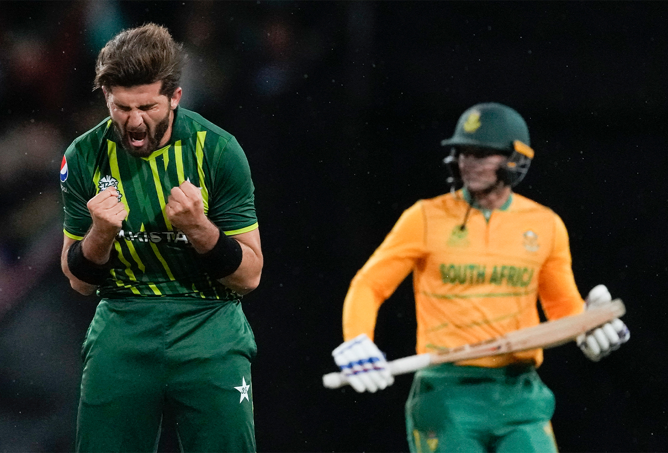 Pakistan's Shaheen Afridi celebrates after dismissing South Africa's Quinton de Kock, right, during the T20 World Cup cricket match between Pakistan and South Africa in Sydney, Australia, on November 3, 2022. (AP)