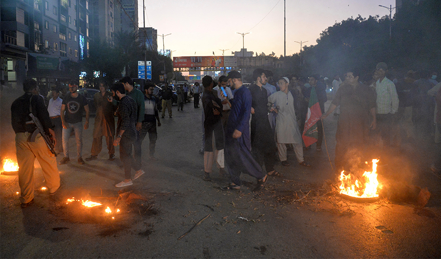Supporters of Pakistan's former prime minister Imran Khan, take part in a protest against the assassination attempt on Khan, in Karachi on November 3, 2022. (AFP)