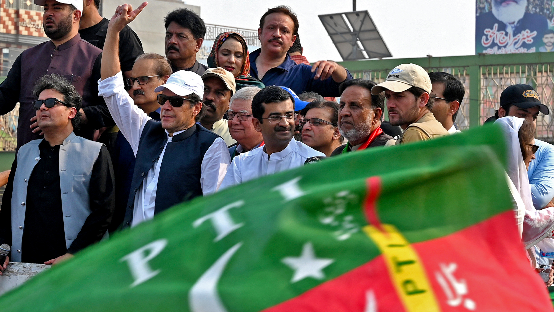 Pakistan's former prime minister Imran Khan (4L) gestures to his supporters during an anti-government march towards Islamabad city, demanding early elections, in Muridke district, about 29 km from Lahore on October 30, 2022. (AFP/File)
