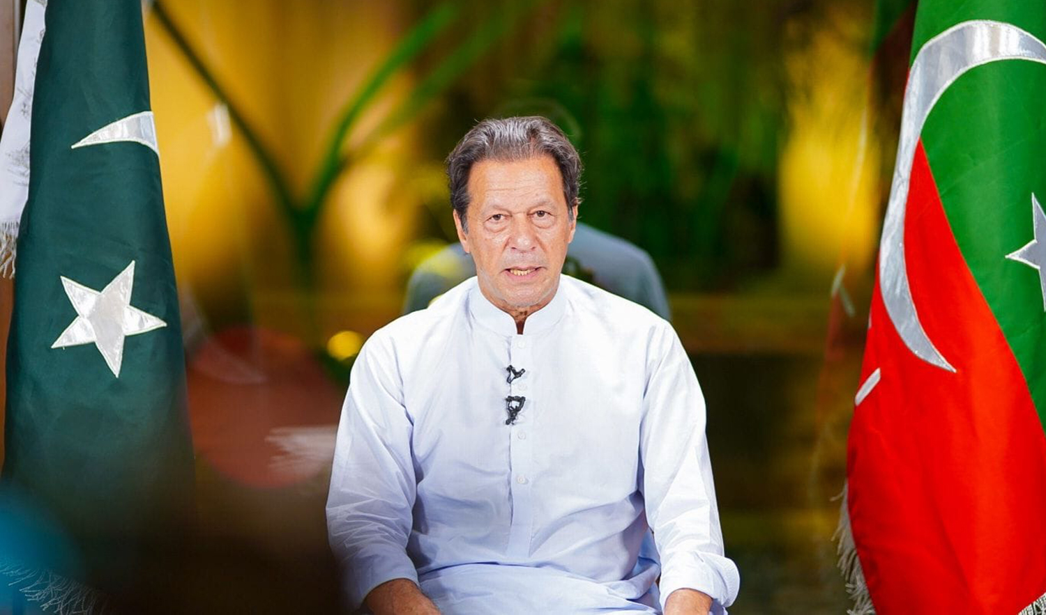 Pakistan's former prime minister Imran Khan virtually addresses his supporters during his Pakistan Tehreek-e-Insaf (PTI) party's march to Islamabad on November 11, 2022. (Photo courtesy: @ImranKhanOfficial/Facebook)