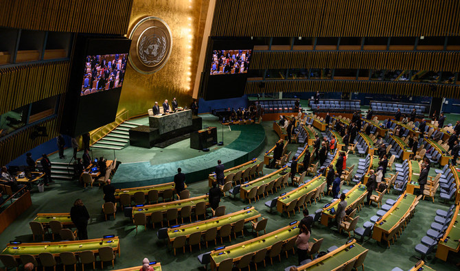 Attendees of a General Assembly meeting stand at the United Nations headquarters in New York on September 15, 2022. (AFP/FILE)