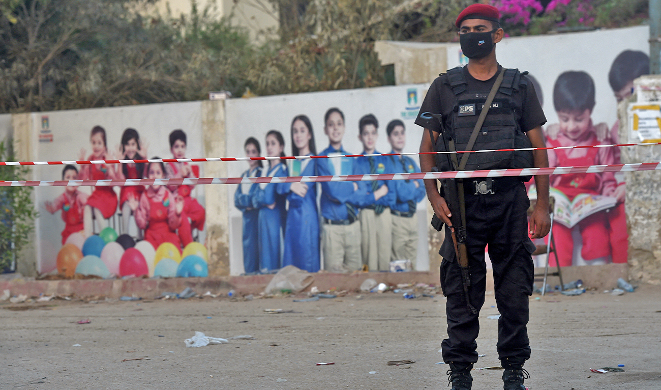 A security personnel stands guard in a residential area in Karachi, Pakistan, on May 23, 2020. (AFP/File)
