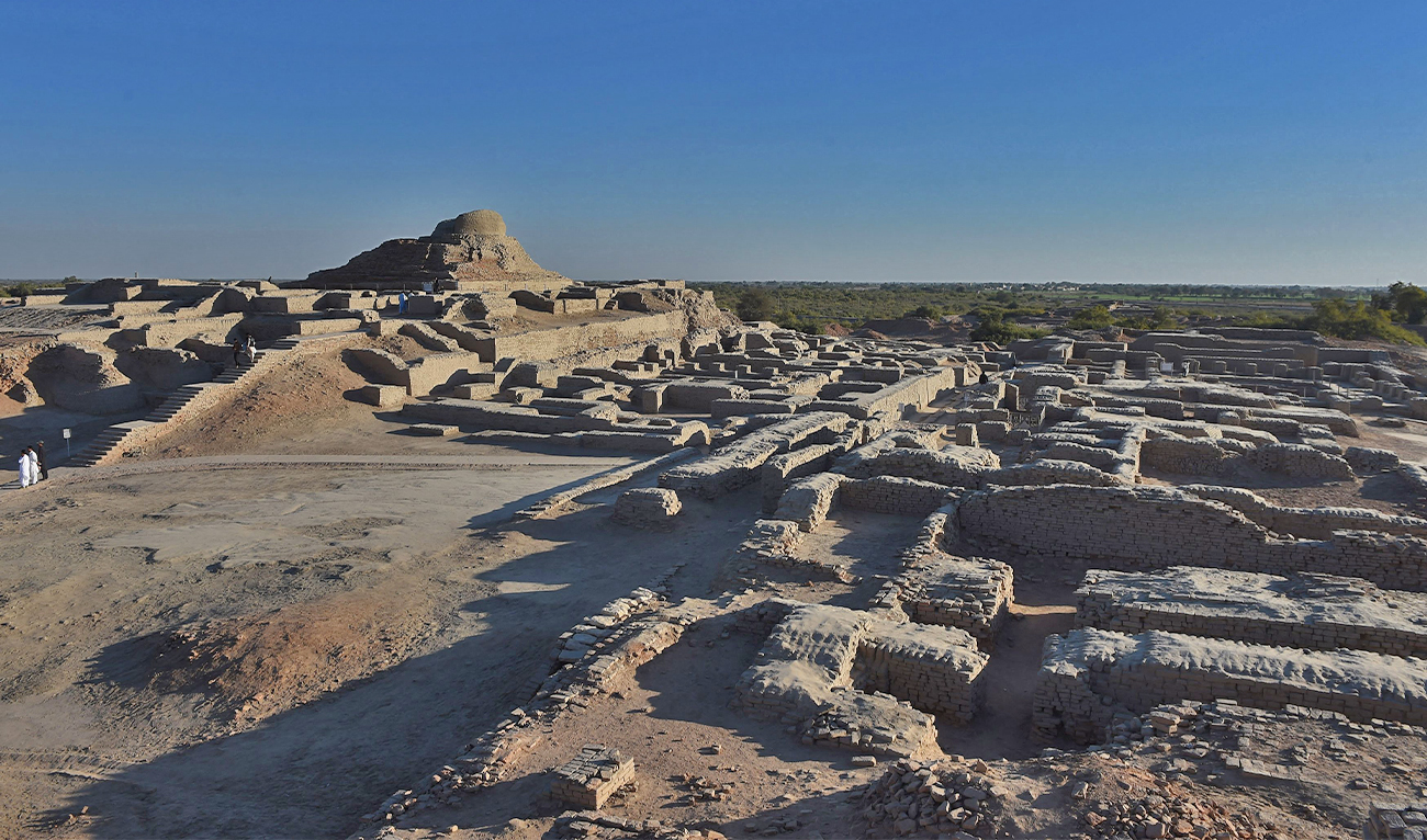 In this file photo taken on February 9, 2017 visitors walk through the UNESCO World Heritage archeological site of Mohenjo Daro some 425 kms north of the Pakistani city of Karachi. (AFP)