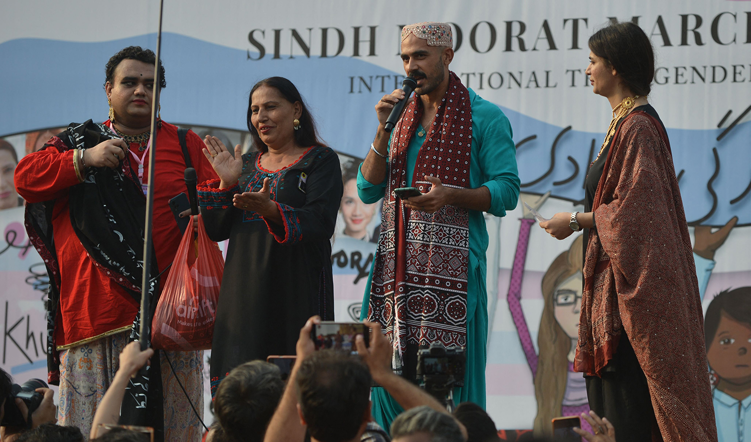 Zulfikar Ali Bhutto Junior, second right, speaks with transgender community activists during Moorat march in Karachi, Pakistan, on November 20, 2022. (AFP)