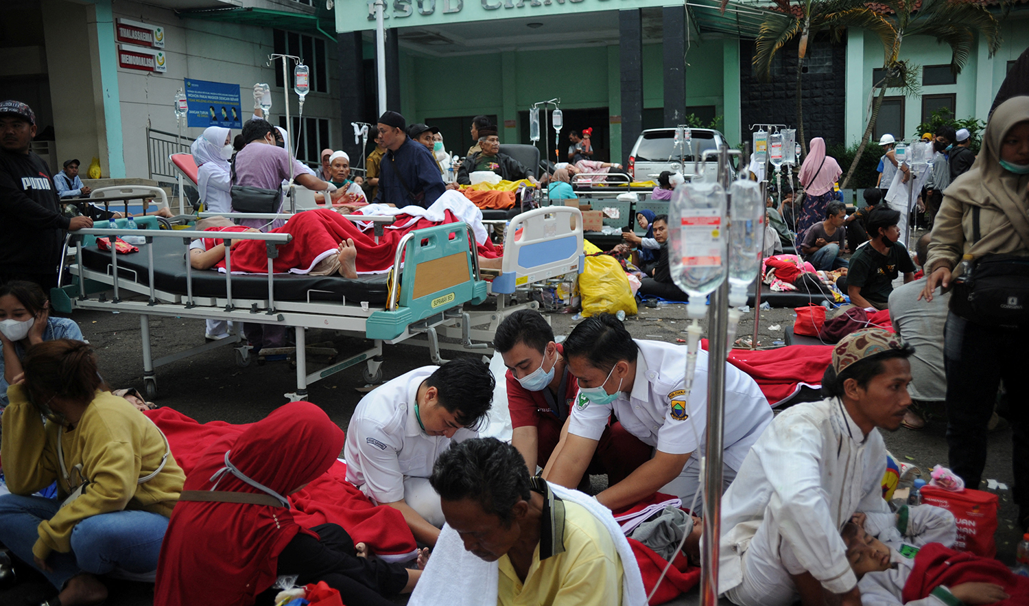 Medical workers treat the victims outside the district hospital after earthquake hit in Cianjur, West Java province, Indonesia, November 21, 2022, in this photo taken by Antara Foto. (Antara Foto via Reuters)