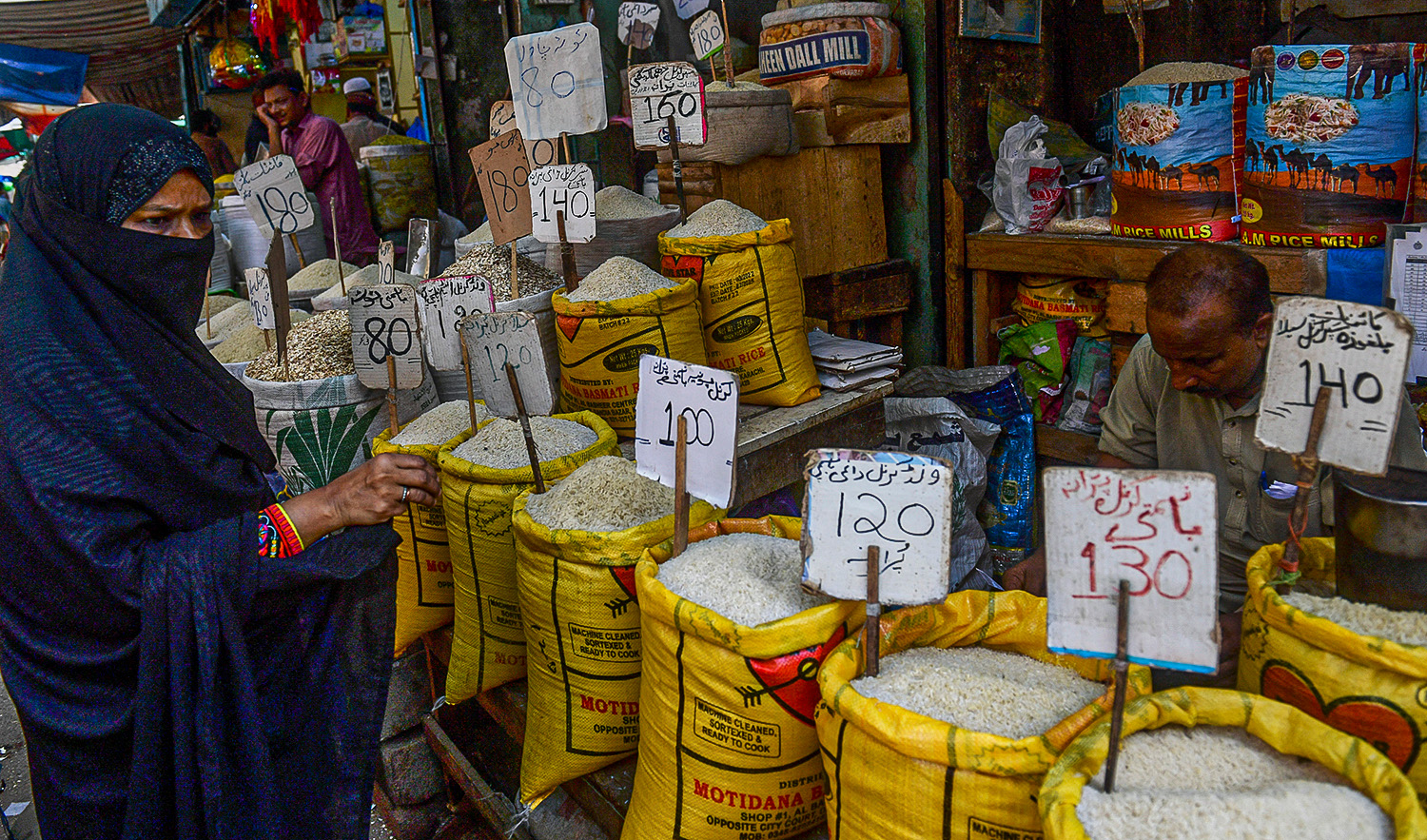 A customer sees the price of rice at a shop in Karachi, Pakistan, on June 10, 2022. (AFP/File)