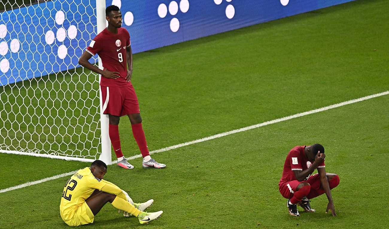 Players react after the final whistle of the Qatar 2022 World Cup Group A football match between Qatar and Senegal at the Al-Thumama Stadium in Doha on November 25, 2022. (Photo courtesy: AFP)