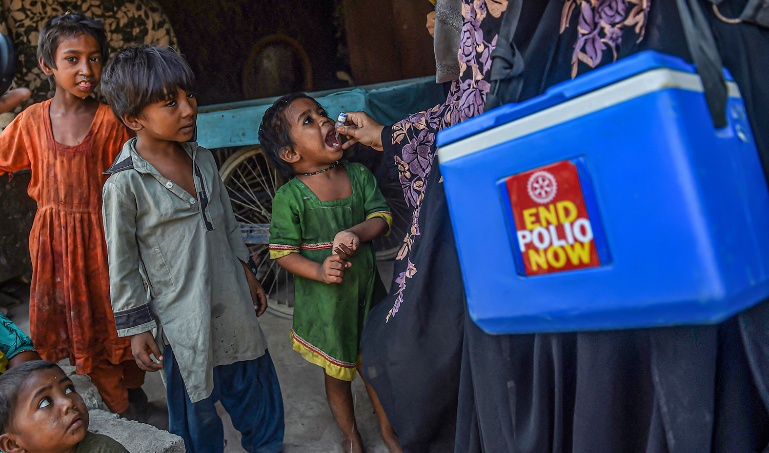 A health worker administers polio vaccine drops to a child during a vaccination campaign in Karachi, Pakistan, on October 24, 2022. (AFP/File)