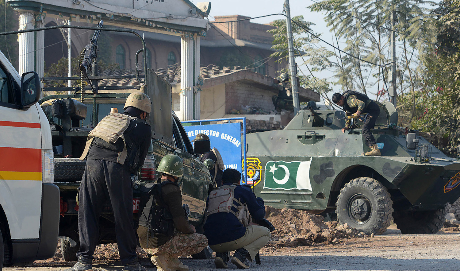 Pakistani security personnel take position outside an Agriculture Training Institute after an attack by Taliban militants in Peshawar on December 1, 2017. (AFP/File)