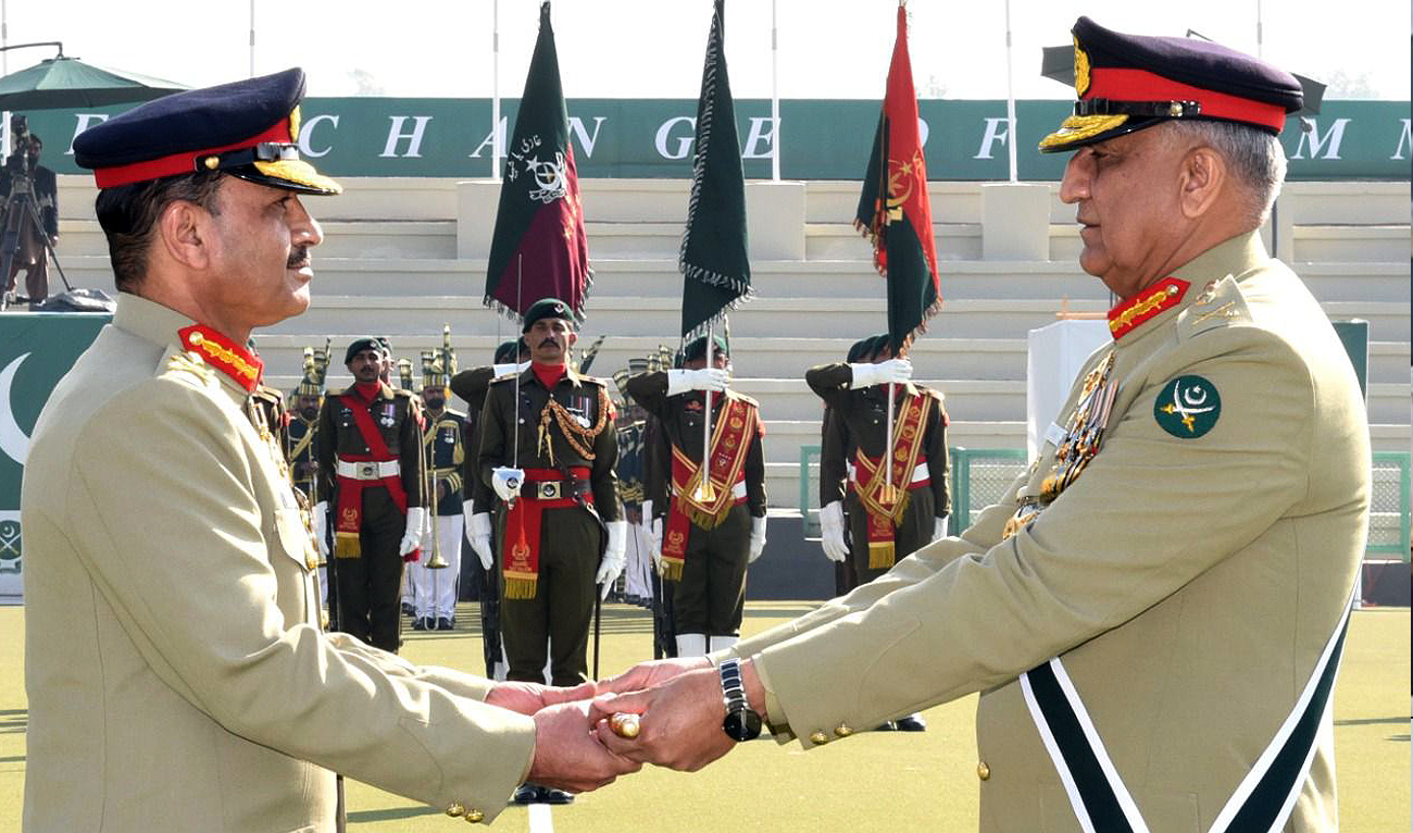 This handout photograph released by Pakistan's Inter Services Public Relations (ISPR) on November 29, 2022 shows General Qamar Javed Bajwa (right) handing over command of Pakistan Army to General Asim Munir (left) at a change-of-command ceremony in Rawalpindi.