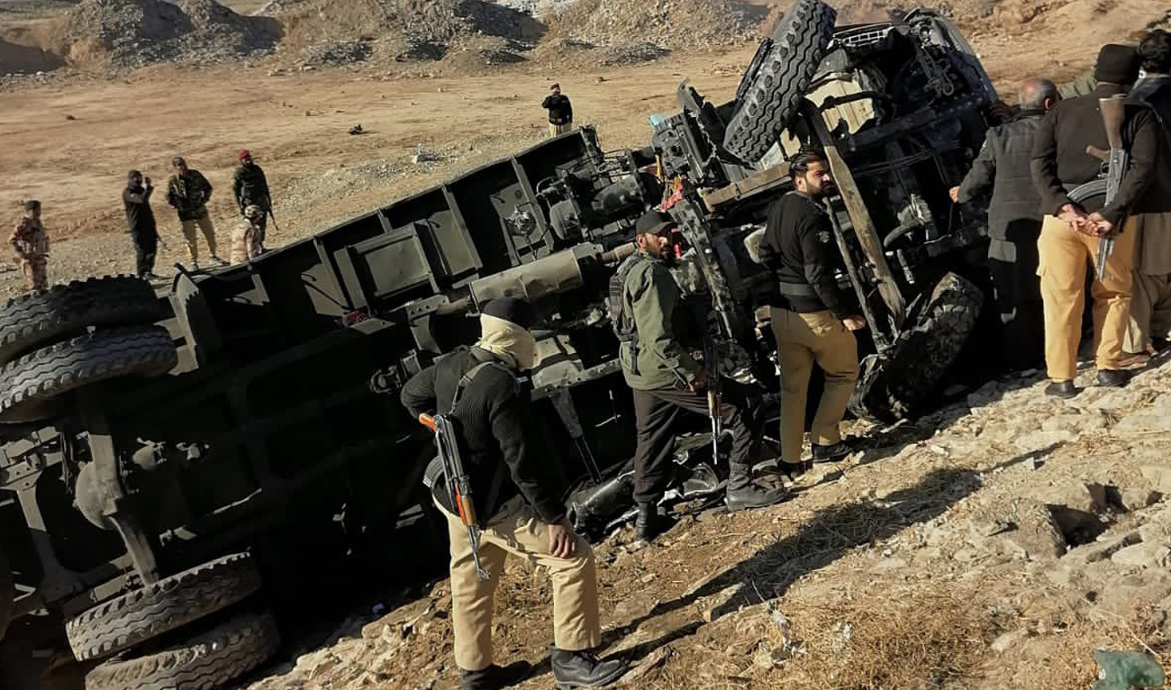 Police inspect a site around a damaged police van following a suicide bombing near Baleli Customs on November 30, 2022. (Photo courtesy: Balochistan police)