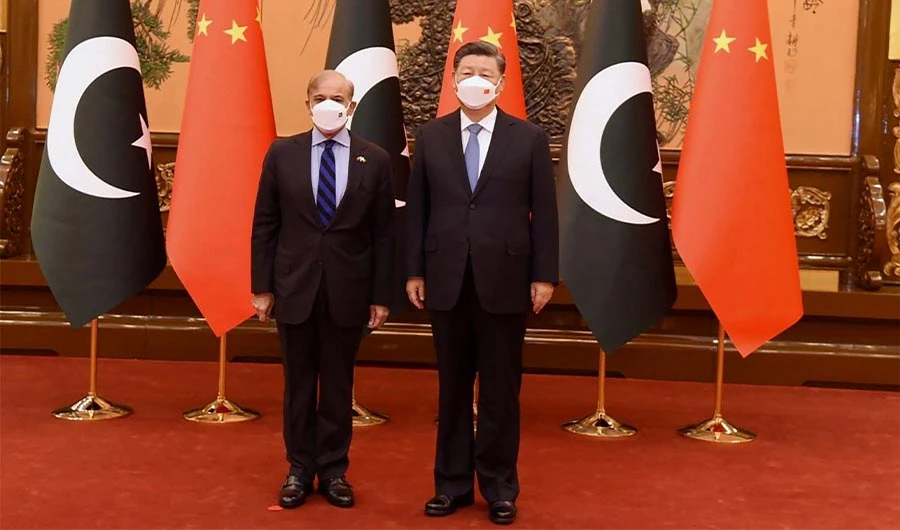 This handout picture released by the Pakistan Prime Minister Office on November 2, 2022, shows Pakistan Prime Minister Shahbaz Sharif (L) pose for a photograph along with China's President Xi Jinping prior to their talks at the Great Hall of the People in Beijing, China. (AFP)