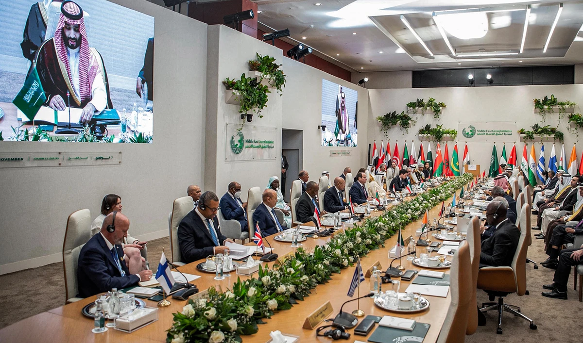 A handout picture provided by the Saudi Royal Palace shows Saudi Arabia's Crown Prince on a projection as he addresses leaders during the second edition of the summit of the Green Middle East Initiative in Egypt on November 7, 2022. (Photo courtesy: AFP)