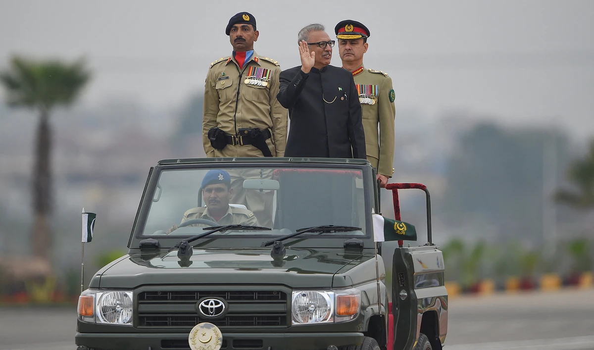 Pakistani President Arif Alvi, center, inspects the honor guard during the Pakistan Day parade in Islamabad on March 23, 2019. (AFP/File)