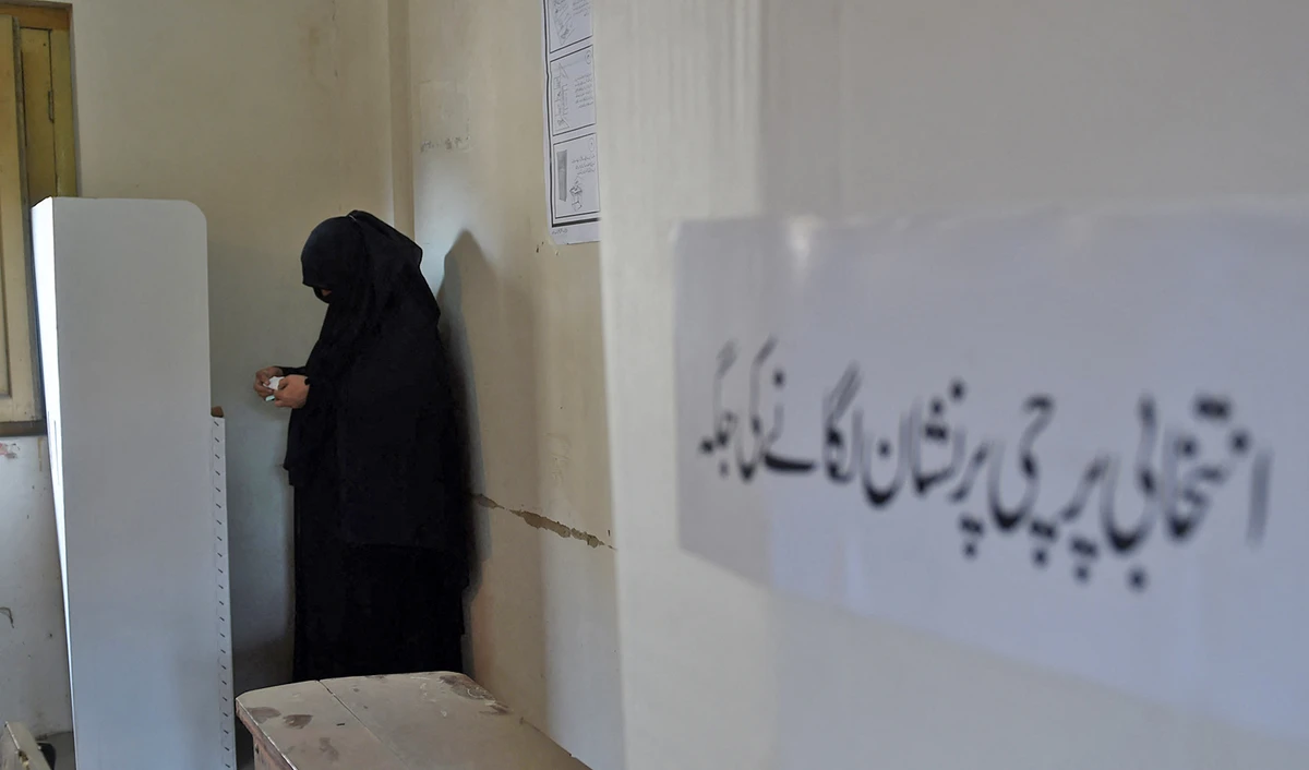 A Pakistani woman casts her ballot at a polling station in Karachi on December 5, 2015, during local government elections. (AFP/File)