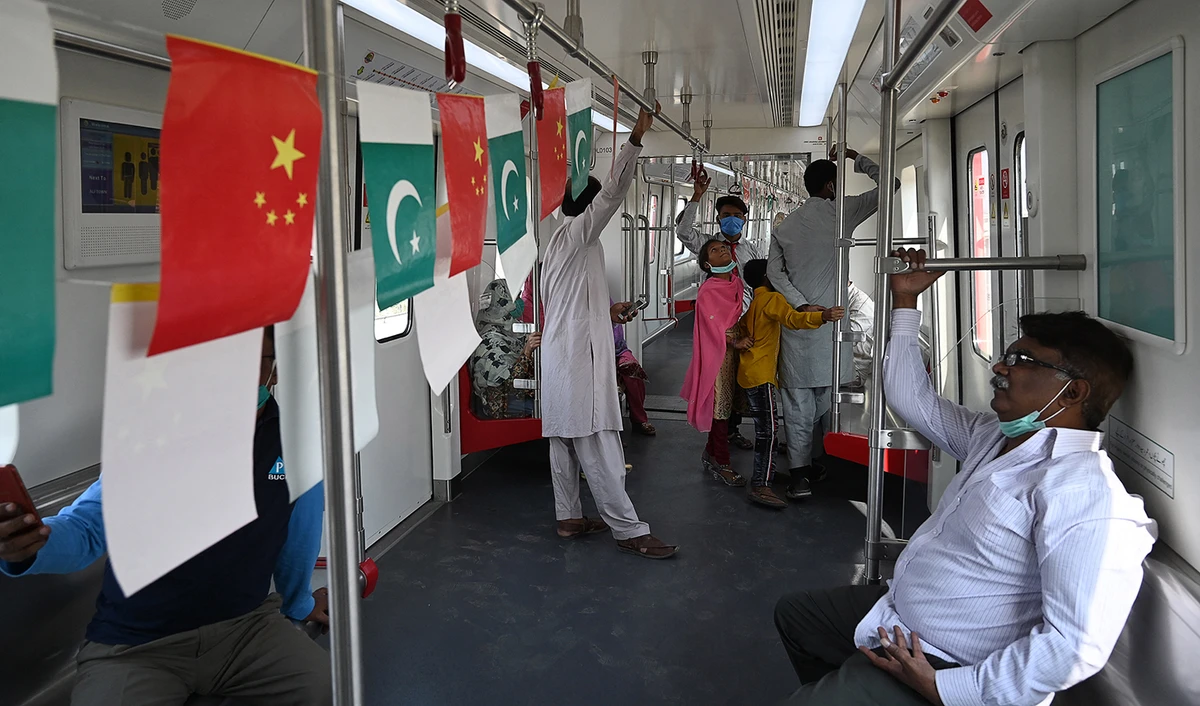 Passengers ride in a newly built Orange Line Metro Train (OLMT), a metro project planned under the China-Pakistan Economic Corridor (CPEC), a day after an official opening in the eastern city of Lahore on October 26, 2020. (AFP/File)