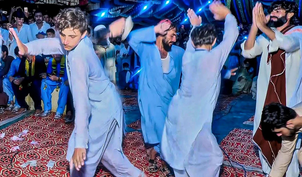 This undated representational photo shows Pakistani men dance at a wedding ceremony in Peshawar. (Photo courtesy: @alazizstudio3227/YouTube)