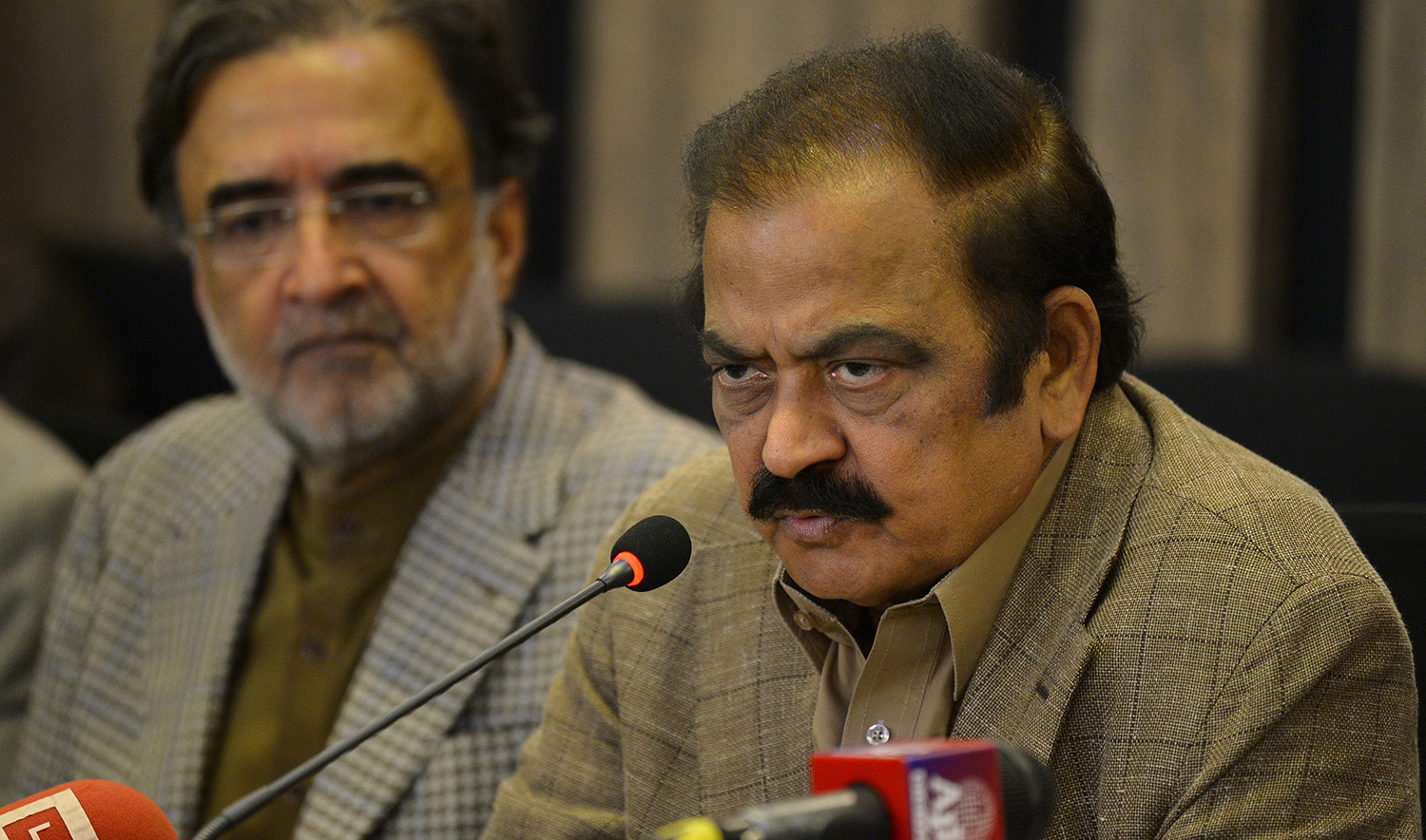 Pakistan Interior Minister Rana Sanaullah, center, speaks during a press conference in Islamabad on May 24, 2022. (AFP/File)