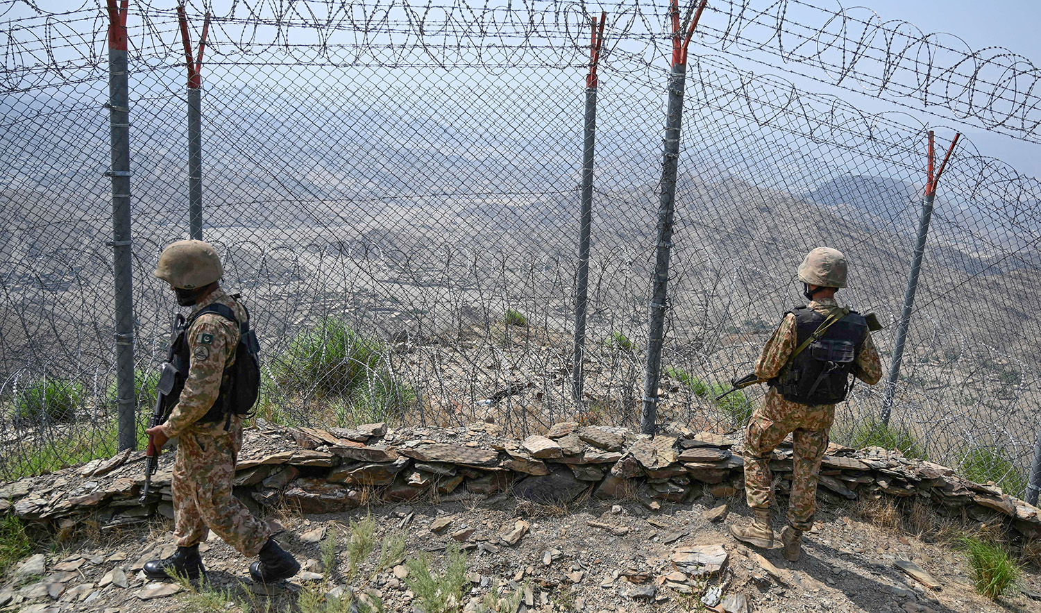 Pakistani troops patrol along Pakistan-Afghanistan border fence at Big Ben post in the Khyber district of the Khyber Pakhtunkhwa province on August 3, 2021. (AFP/File)