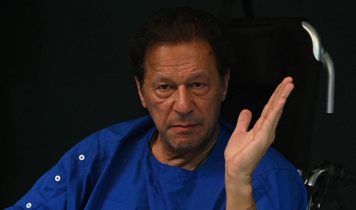 Pakistan's former prime minister Imran Khan talk with media representatives at a hospital in Lahore on November 4, 2022, a day after an assassination attempt on him during his long march near Wazirabad. (AFP/File)