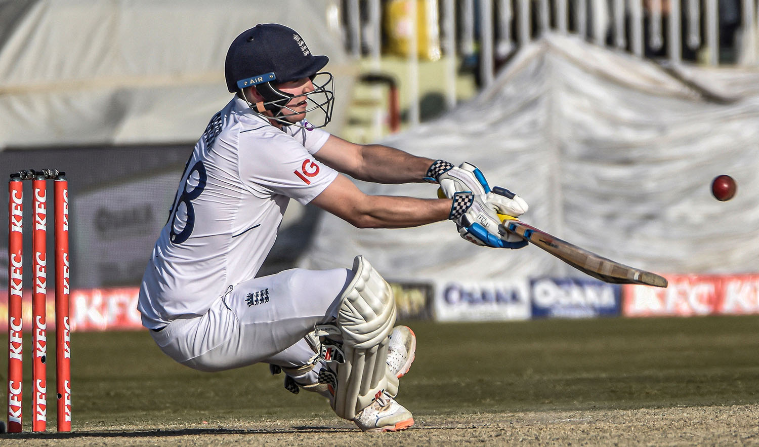 England's Harry Brook falls as he tries to play a shot during the first Test match of the series against in Rawalpindi on December 4, 2022. (REUTERS)