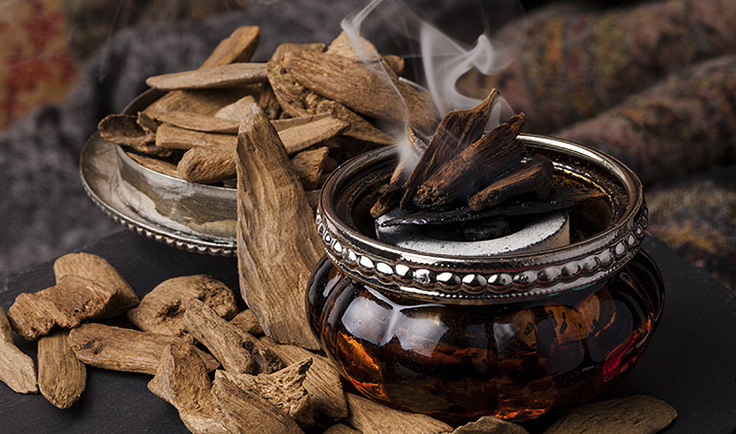 In this undated photo, bakhoor, or agarwood chips, are soaked with jasmine and sandalwood to soften and sweeten the heavy scents, with amber and citrus oils to add crisp notes. (Courtesy: Three Kings)