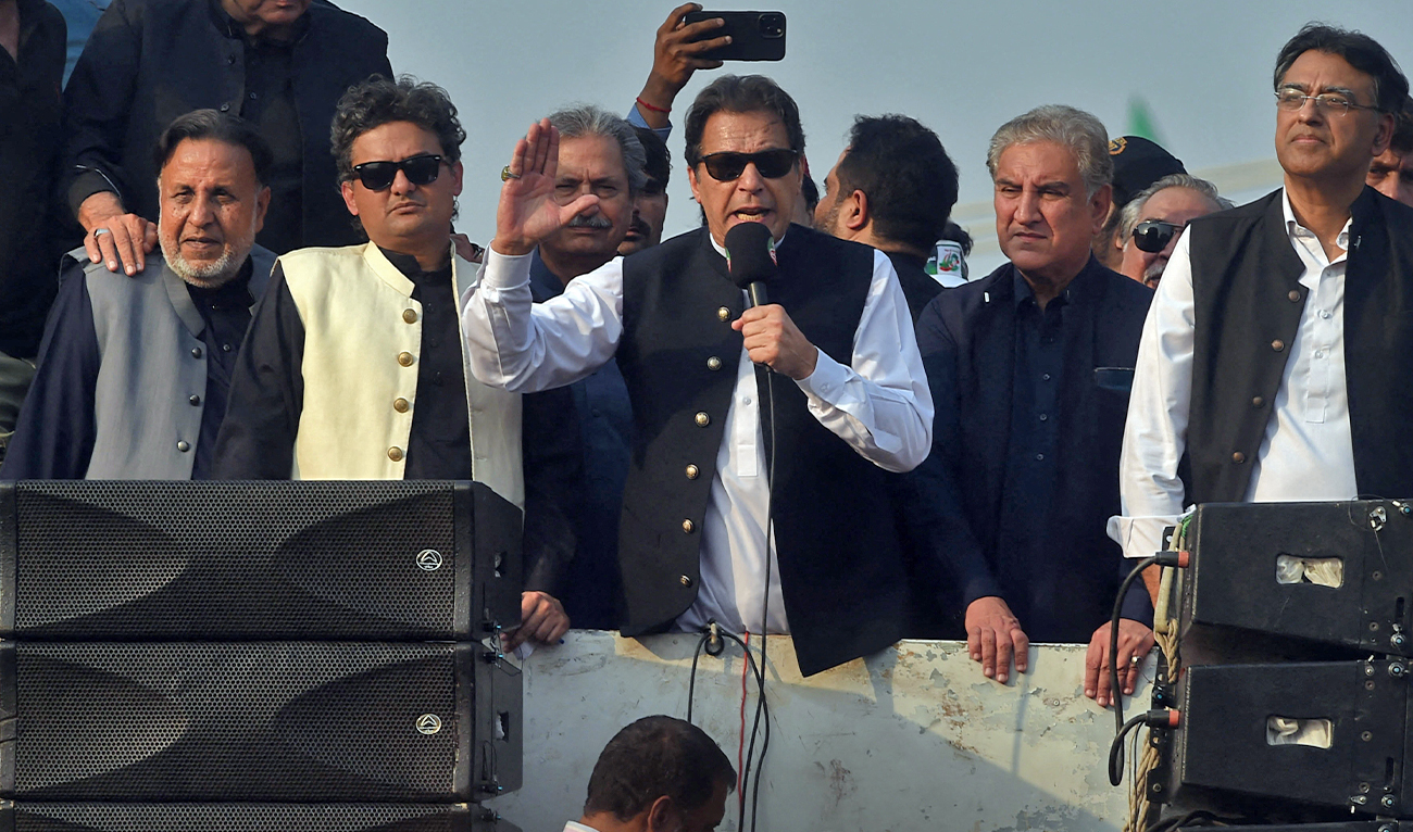Former Pakistan prime minister Imran Khan (C) addresses his supporters during an anti-government long march towards Islamabad to demand early elections, in Lahore on October 28, 2022. (AFP/File)