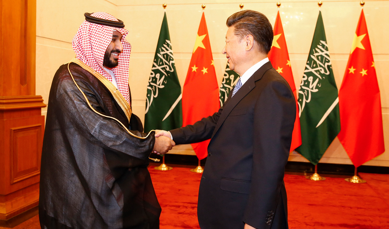 In this file photo, Saudi Arabia's then-deputy Crown Prince Mohammed bin Salman (L) greets Chinese President Xi Jinping (R) during a meeting at the Diaoyutai State Guesthouse in Beijing on August 31, 2016. (Photo courtesy: AFP/File)
