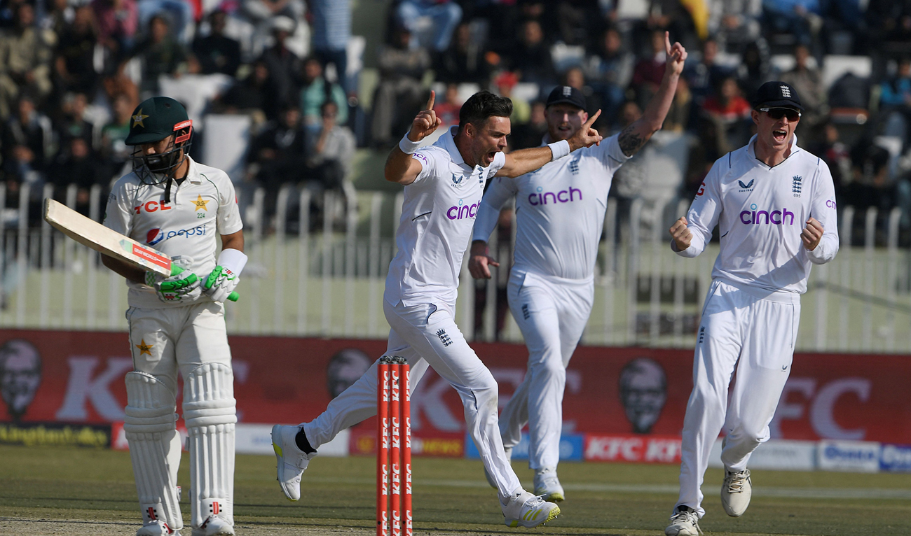 England's James Anderson (2L) celebrates after taking the wicket of Pakistan's Mohammad Rizwan (L) during the fifth and final day of the first cricket Test match between Pakistan and England at the Rawalpindi Cricket Stadium, in Rawalpindi on December 5, 2022. (Photo courtesy: AFP)