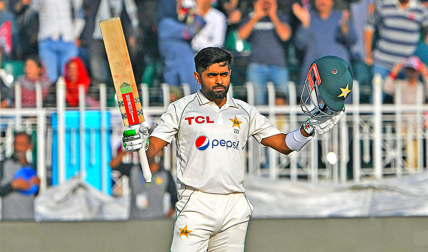 Pakistan's captain Babar Azam celebrates after scoring a century (100 runs) during the third day of the first cricket Test match between Pakistan and England at the Rawalpindi Cricket Stadium, in Rawalpindi on December 3, 2022. (AFP)