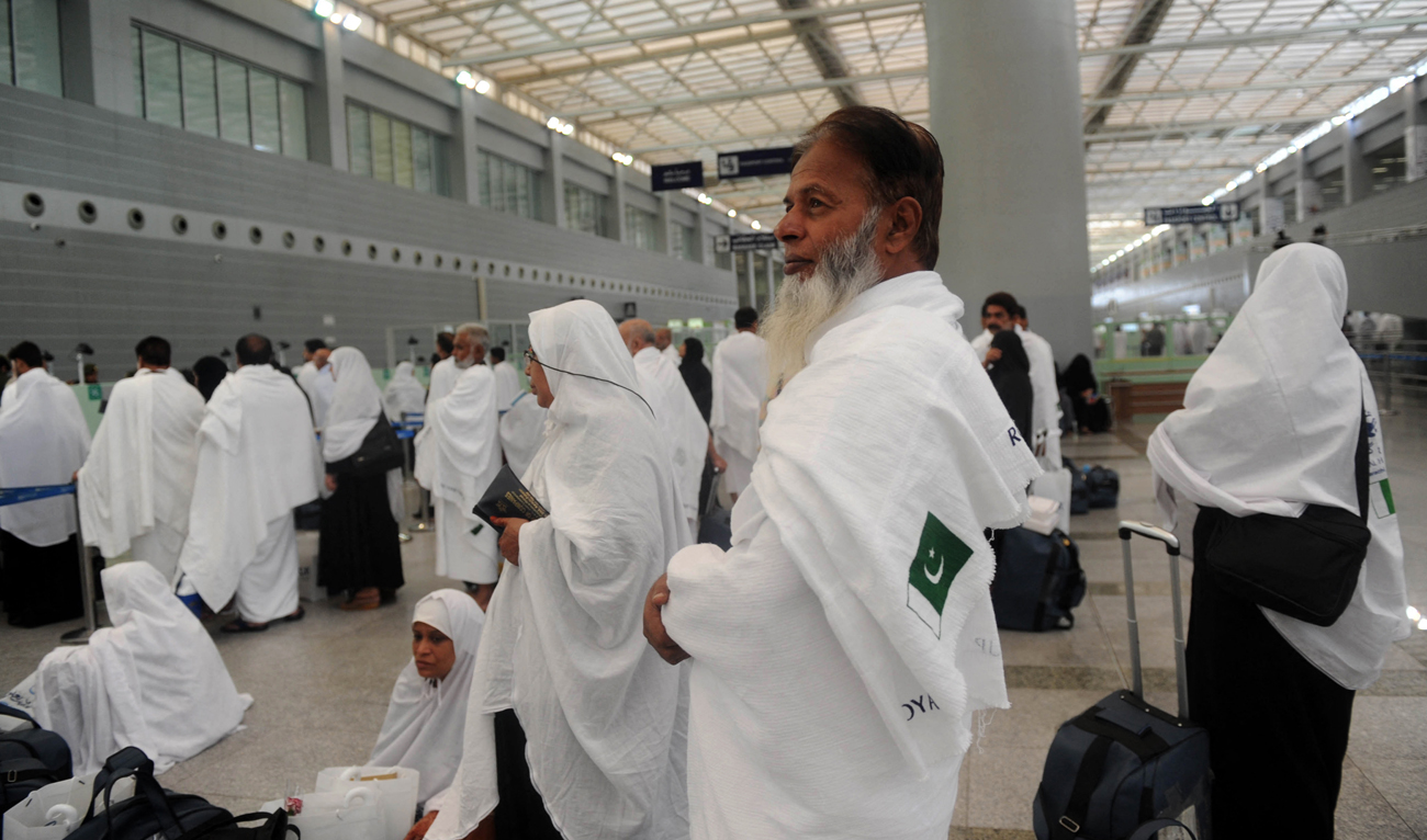 In this file photo, taken on July 24, 2017, Pakistani Muslims wait to pass security as the first pilgrims for the annual Hajj pilgrimage arrive in Jeddah. (Photo courtesy: AFP/File)