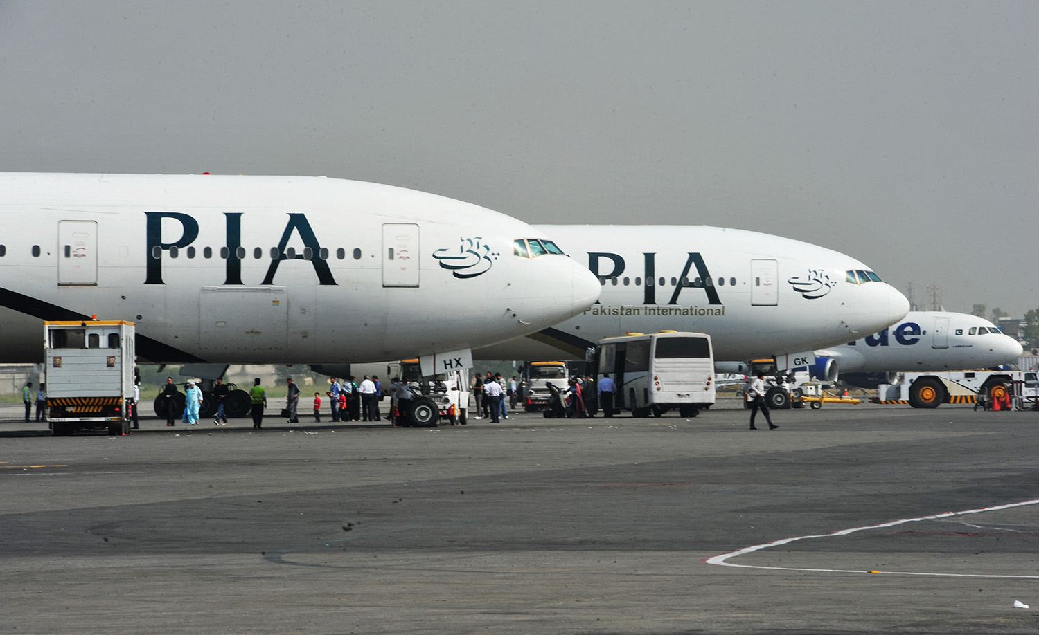 Pakistan International Airline (PIA) planes are positioned on the tarmac at the Benazir Bhutto International Airport in Islamabad on October 10, 2012. (AFP/File)