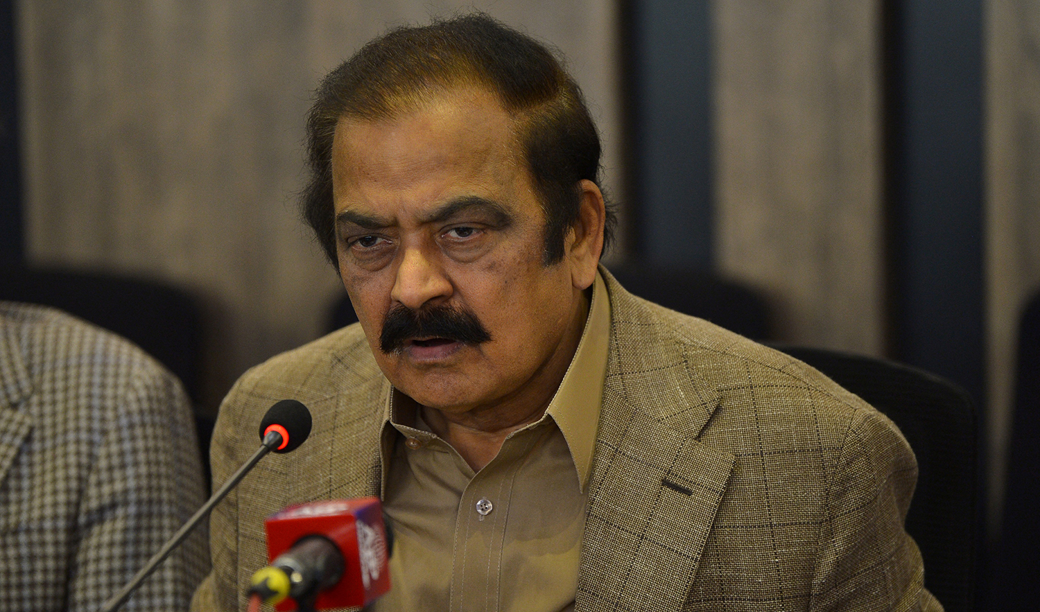 Pakistan Interior Minister Rana Sanaullah, center, speaks during a press conference in Islamabad on May 24, 2022. (AFP/File)