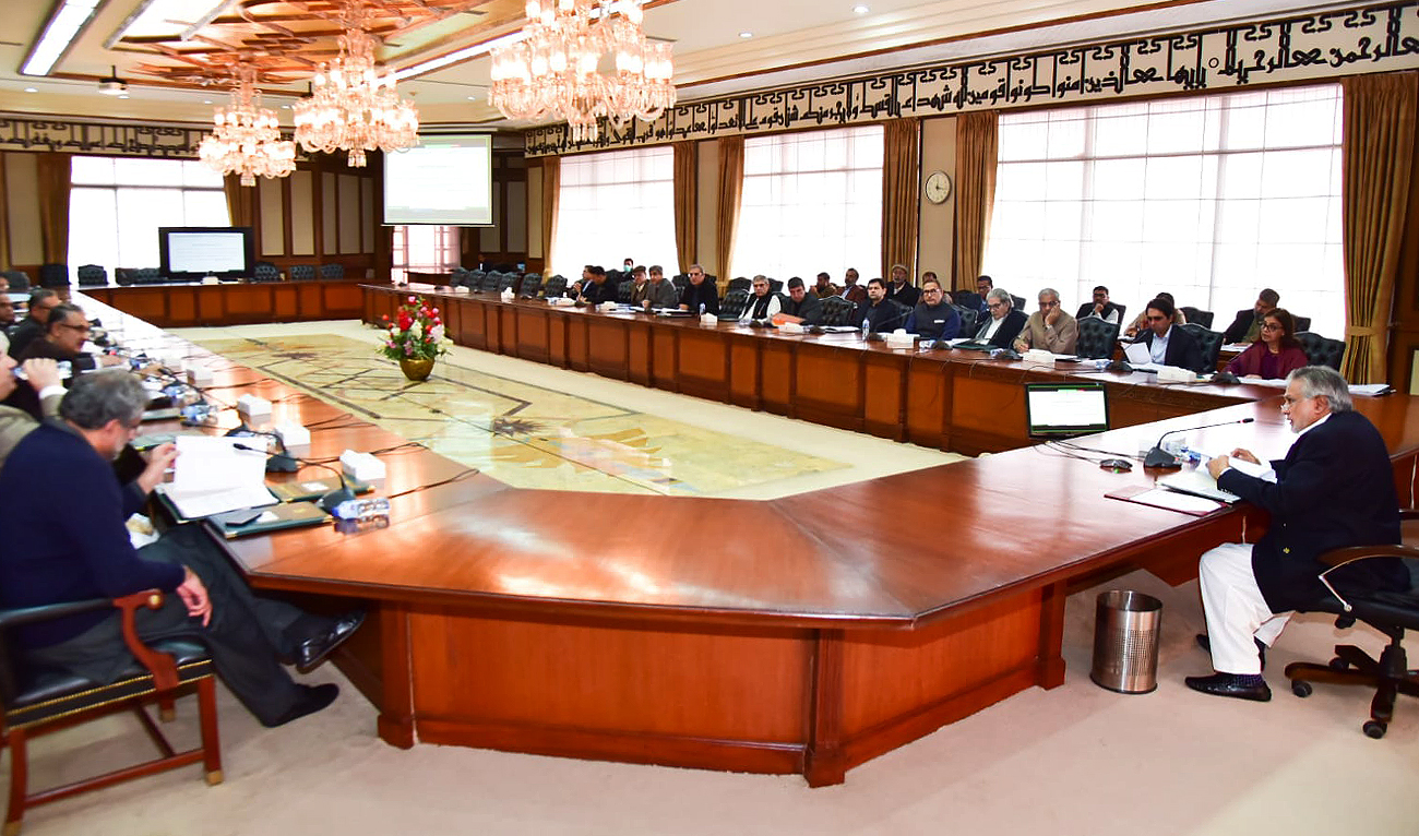 This handout picture, released by Finance Ministry on December 2, 2022, shows Pakistan's finance minister Ishaq Dar chairing the Economic Coordination Committee in Islamabad. (Photo courtesy: Twitter/FinMinistryPak)