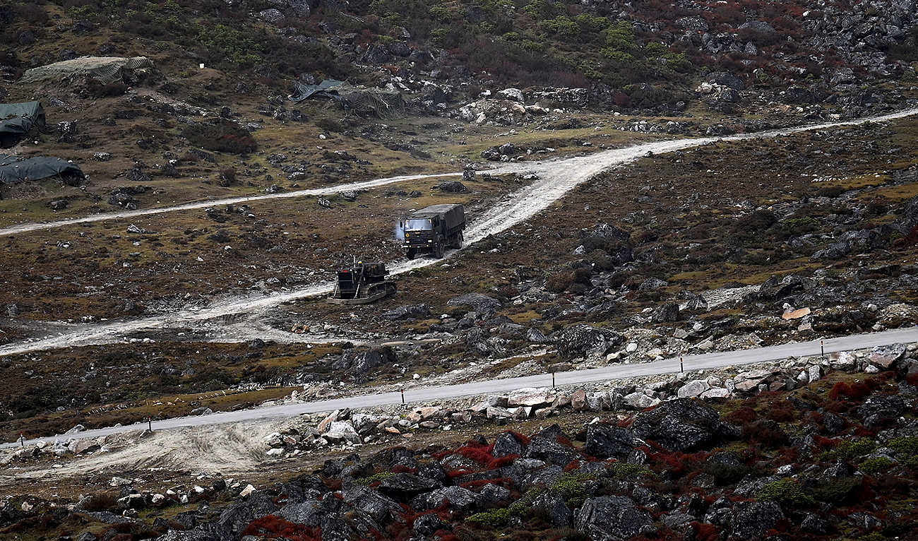 An Indian Army truck drives along a road to Tawang, near the Line of Actual Control (LAC), neighbouring China, near Sela Pass in India's Arunachal Pradesh state on October 21, 2021. (Photo courtesy: AFP/File)